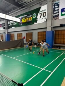 Picklr Lifestyle founder playing pickleball indoors.
